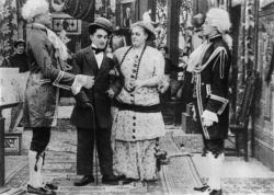 Charlie Chaplin and Marie Dressler dealing with the hired help in Tillie's Punctured Romance Charlie Chaplin and Marie Dressler dealing with the hired help in Tillie's Punctured Romance