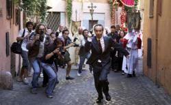 Roberto Benigni gets chased by papparazi in Woody Allen's To Rome with Love.