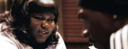 Gabby Sidibe attempts to seduce Eddie Murphy in Tower Heist.