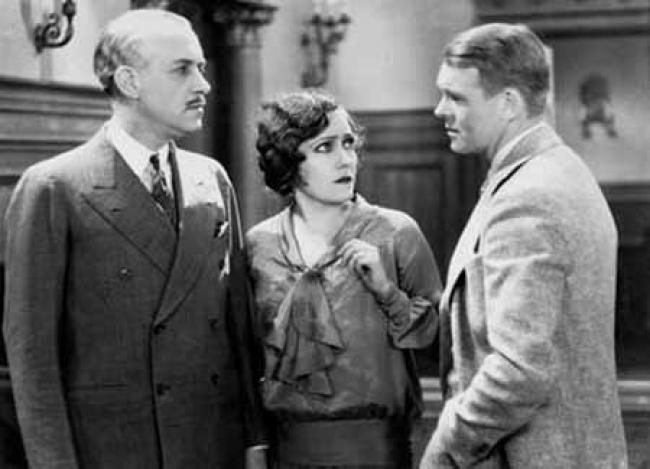 William Holden (not that William Holden), Gloria Swanson, and Robert Ames in The Trespasser. William Holden (not that William Holden), Gloria Swanson, and Robert Ames in The Trespasser.