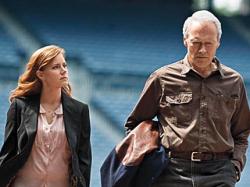Amy Adams and Clint Eastwood in Trouble with the Curve. Amy Adams and Clint Eastwood in Trouble with the Curve.