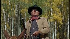 John Wayne as Rooster Cogburn right before his famous shootout on horseback.