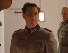 Tom Cruise as Colonel Claus von Stauffenberg, after he lost his eye, but with his glass eye in place, instead of his eye-patch.  