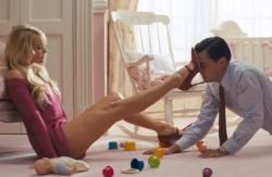 Margot Robbie and Leonardo DiCaprio in The Wolf of Wall Street. Margot Robbie and Leonardo DiCaprio in The Wolf of Wall Street.
