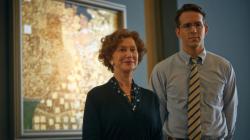 Helen Mirren and Ryan Reynolds posing in front of Helen Mirren and Ryan Reynolds posing in front of