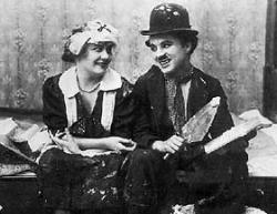 Edna Purviance and Charlie Chaplin.